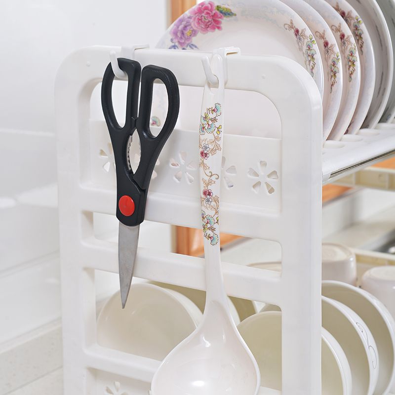 kitchen utensils hanging on the cutlery storage holder